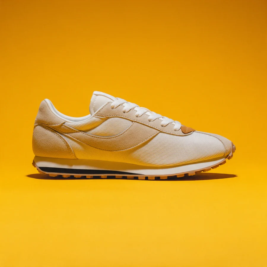 Retro low-top sneaker on a bold colored studio backdrop